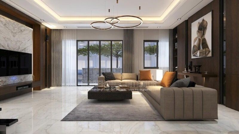 Thiết kế nội thất phòng khách cao cấp ấn tượng với cách trang trí cuốn hút đối lập giữa hai mảng tường chính: bức tranh canvas trừu tượng nâu trầm tương phản với sự mạnh mẽ từ khối đá đối vân lớn.